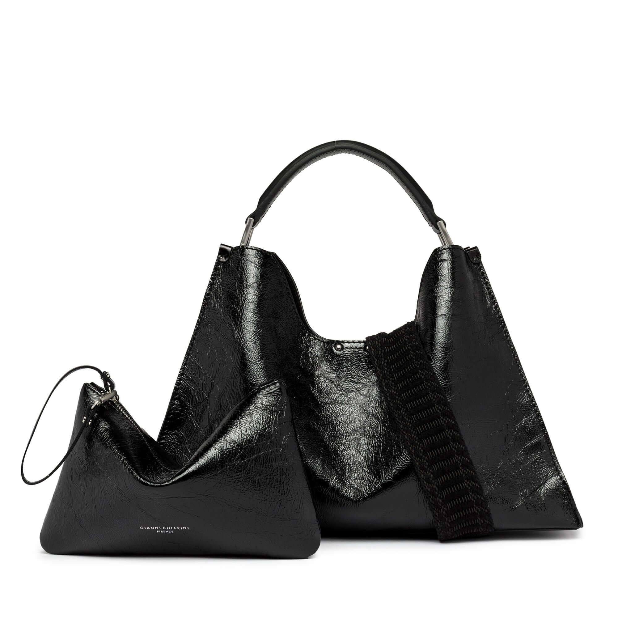 Black glossy leather trapezoid handbag Aurora by Gianni Chiarini with detachable zip pouch.