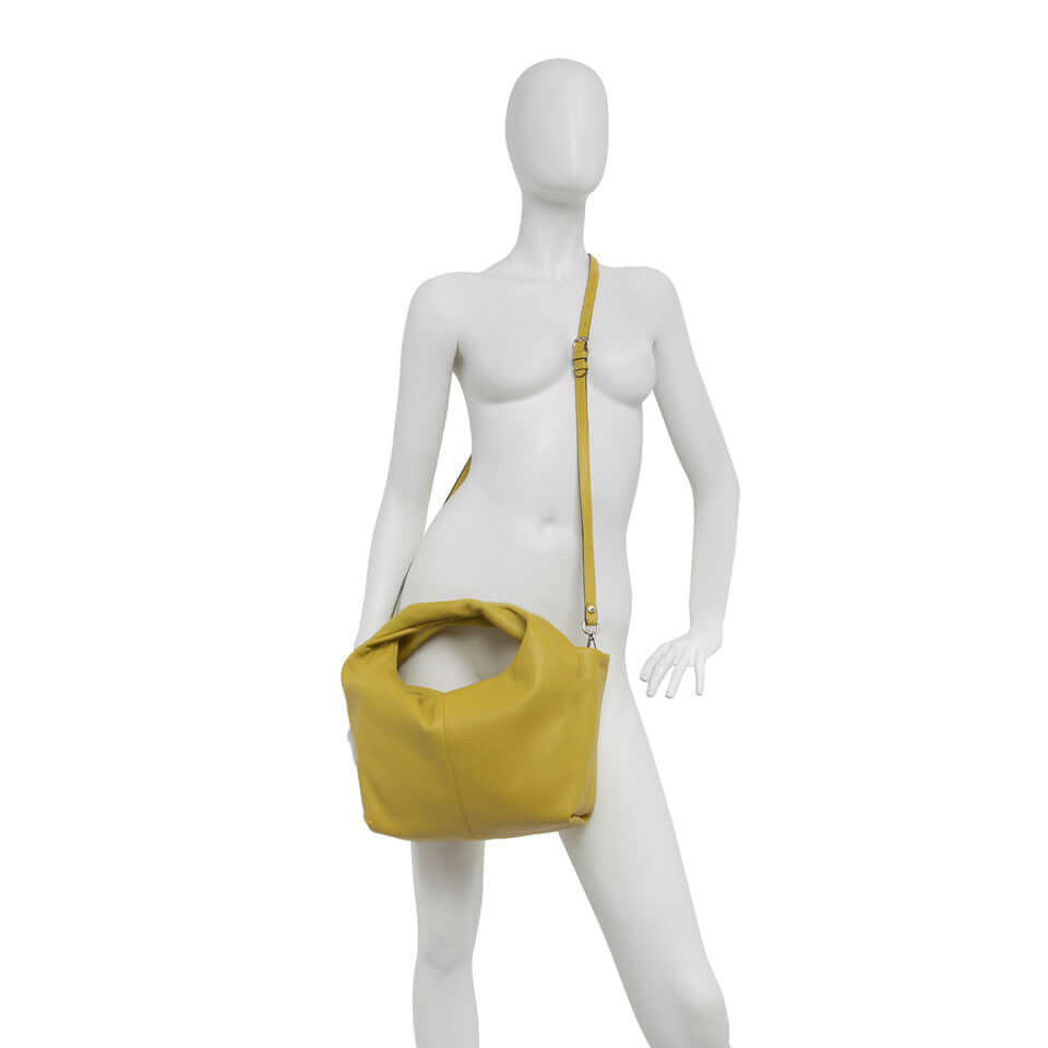 Agnese medium-sized handbag with double handles, featuring a zipper closure and adjustable crossbody strap.