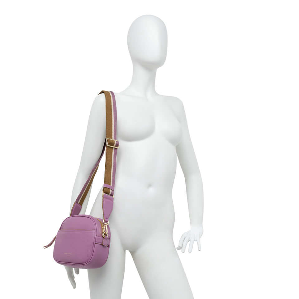 La Nina by Gianni Chiarini, a stylish pink crossbody bag on a mannequin.