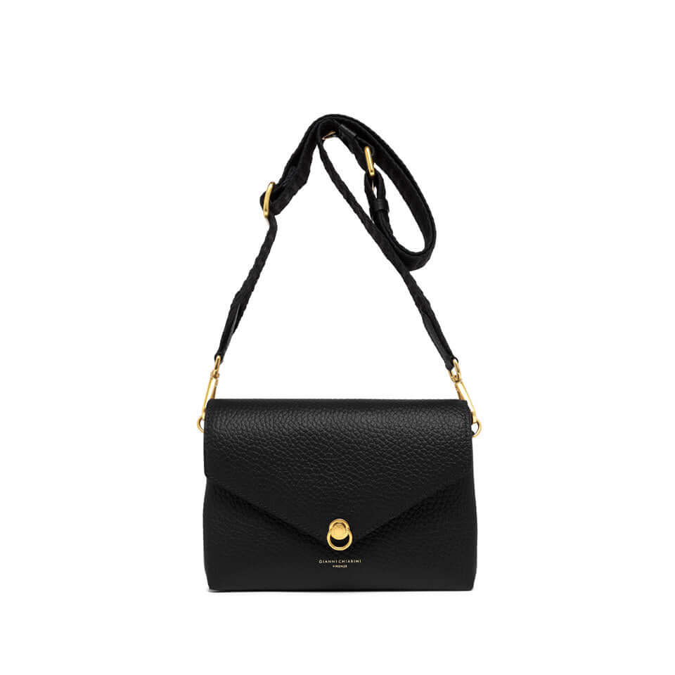 Corallo mini bag in black leather with a magnetic closure and decorative ring, featuring a woven fabric strap.