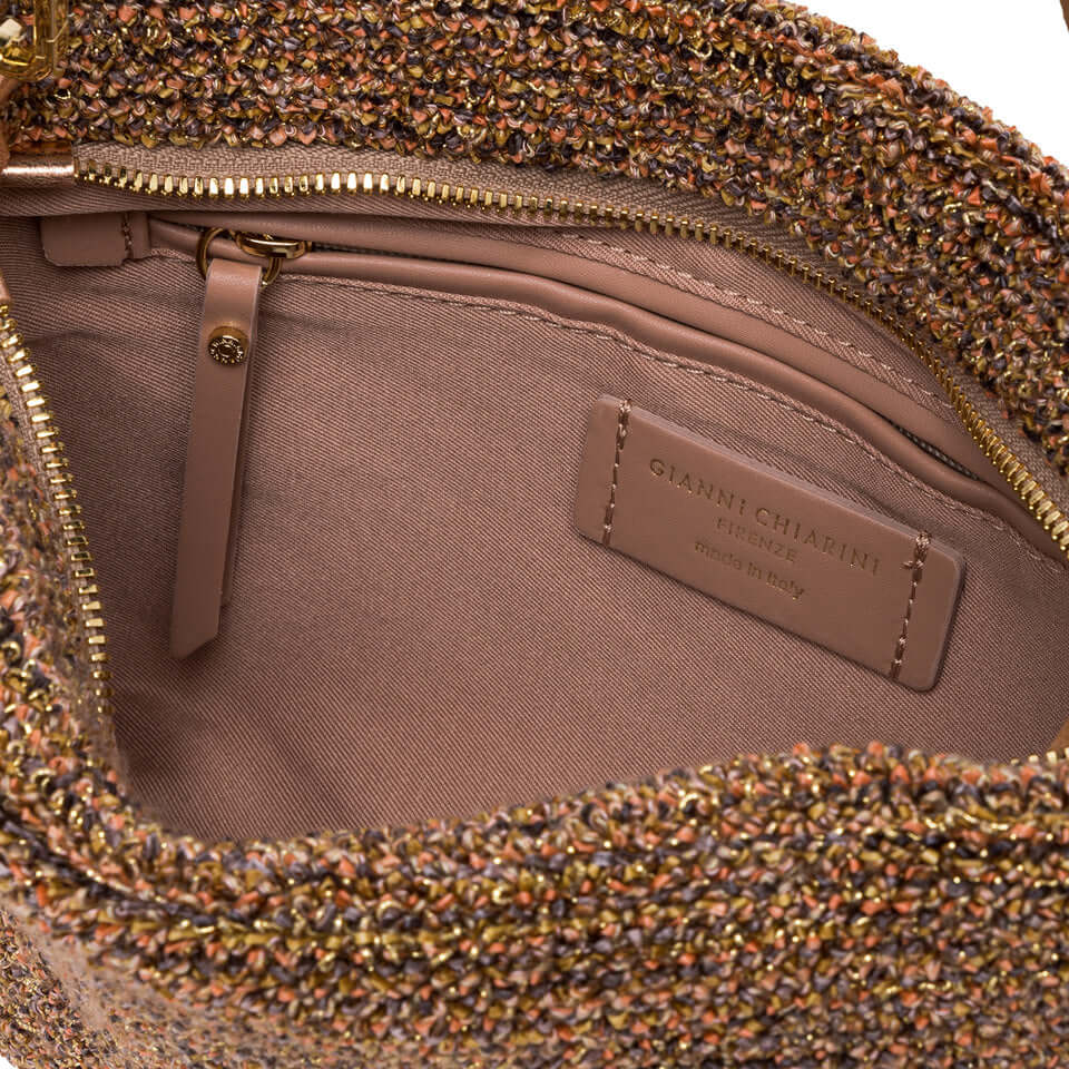 Interior view of Gianni Chiarini La Brenda pochette featuring a spacious pocket and textured fabric design.