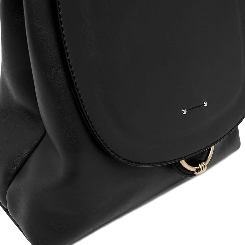 Marlene black leather handbag by Gianni Chiarini featuring a gold ring detail and large flap closure.