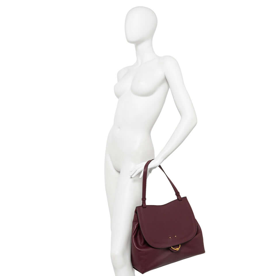 Marlene handbag by Gianni Chiarini, stylish design in burgundy leather with a maxi flap and iconic knot detail.