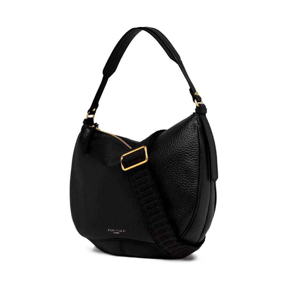 Chiara black leather handbag with vintage flair, featuring zipper closure and removable crossbody strap.