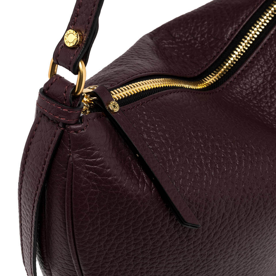 Close-up of the CHIARA leather handbag featuring a gold zipper detail and rich burgundy color.