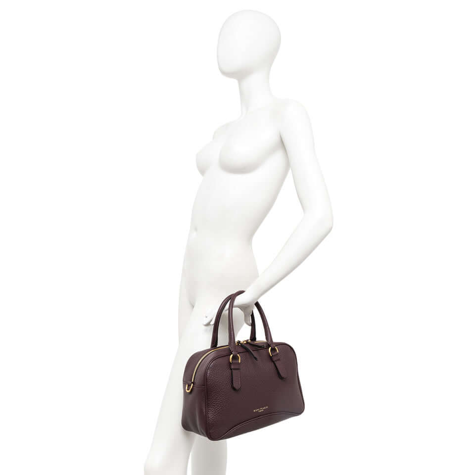Chiara vintage-inspired leather handbag in dark burgundy with dual handles and removable cross-body strap.