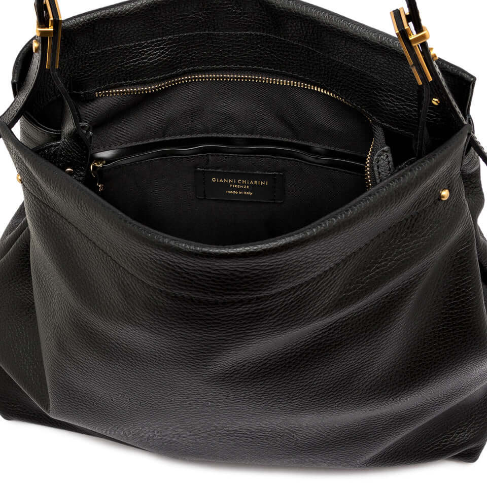 Inside view of the Matilde shoulder bag, showcasing soft leather material and organized compartments.