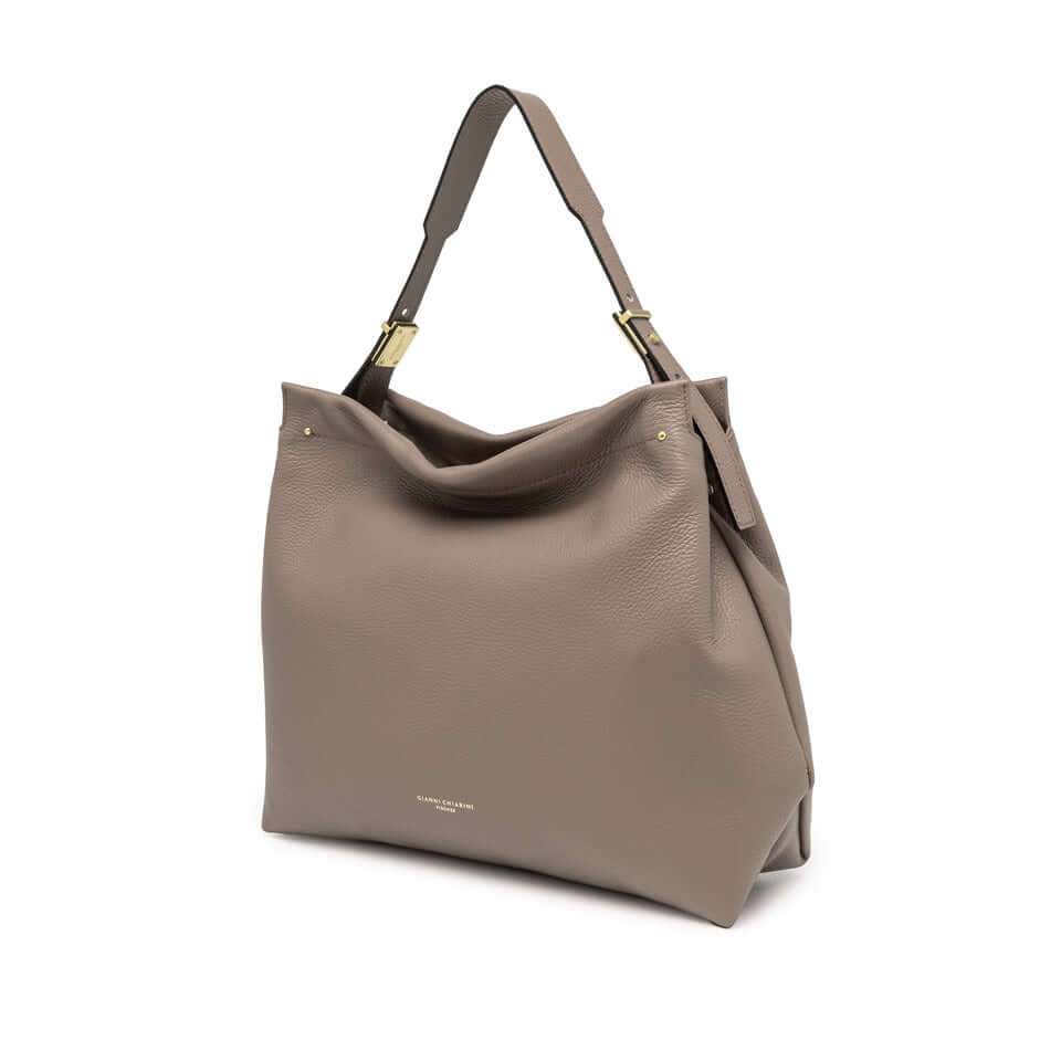 Elegant Matilde shoulder bag in soft, textured leather with a zip closure and gold finishes.
