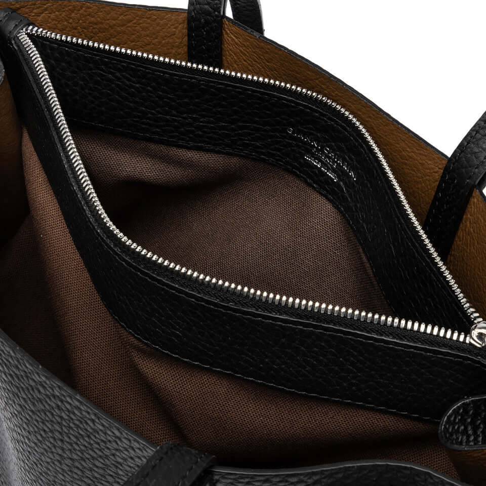 Detail of Altea bag's interior showcasing the spacious zipper pocket and quality leather finish.