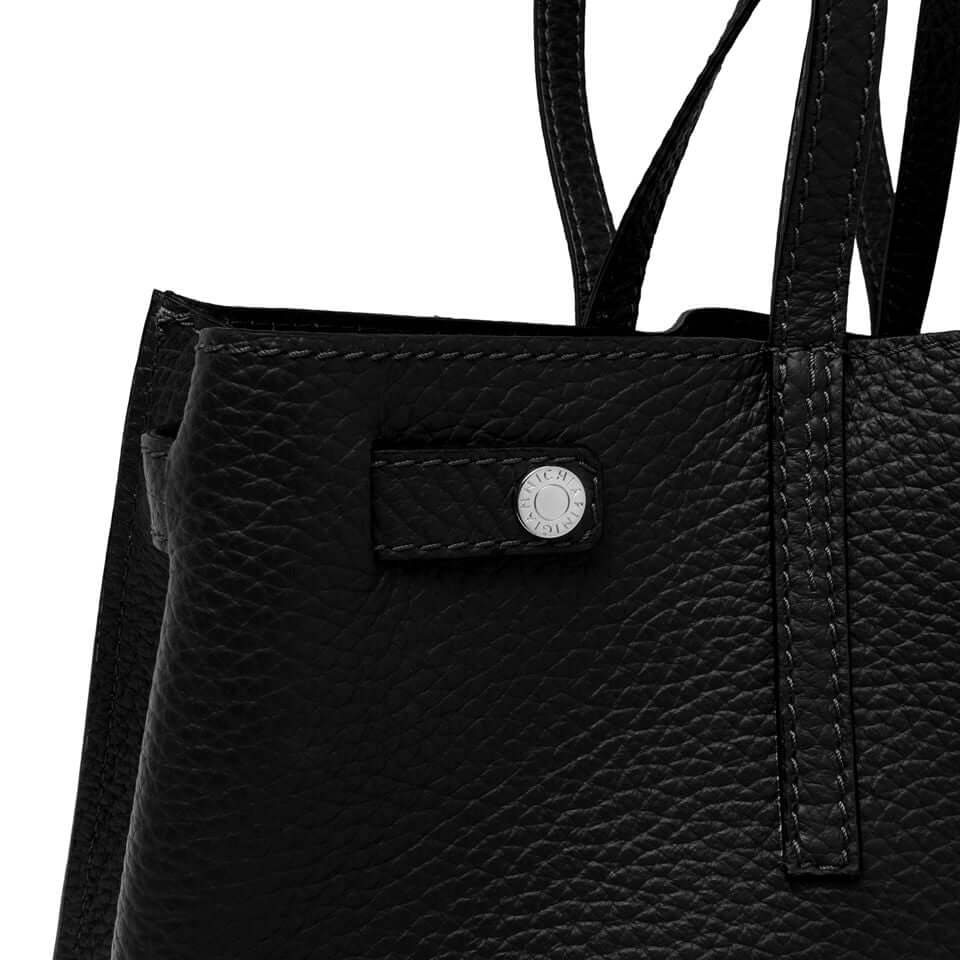 Close-up of the Altea black leather bag showcasing its textured finish and stylish design details.