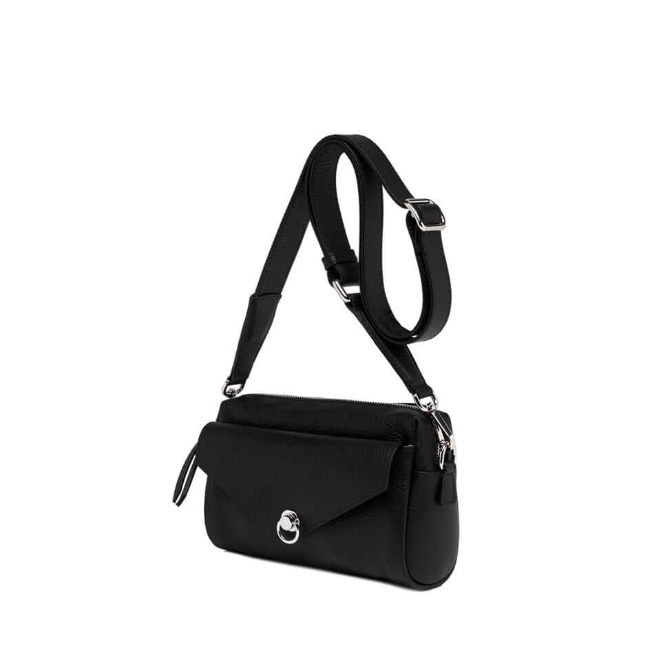 Black Deva bag in soft leather with a removable shoulder strap and iconic front piercing detail, 21x15x6 cm.