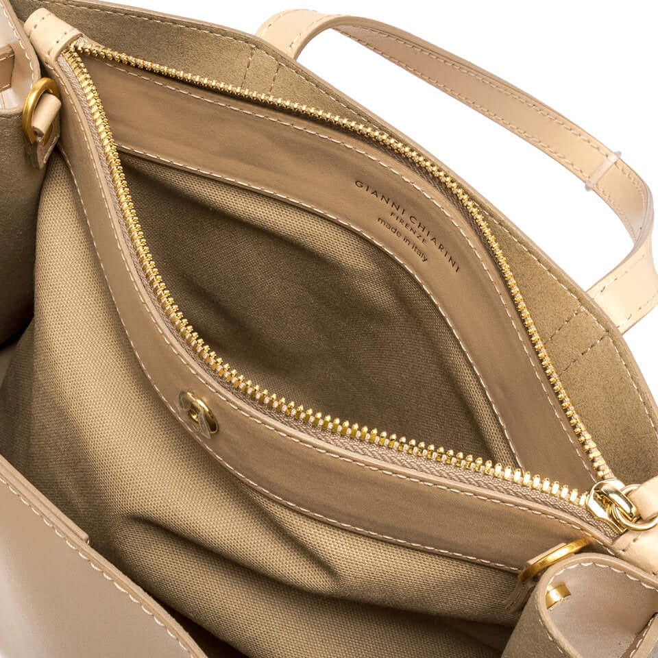 Interior view of the elegant Altea handbag featuring a removable inner pocket and smooth leather finish.