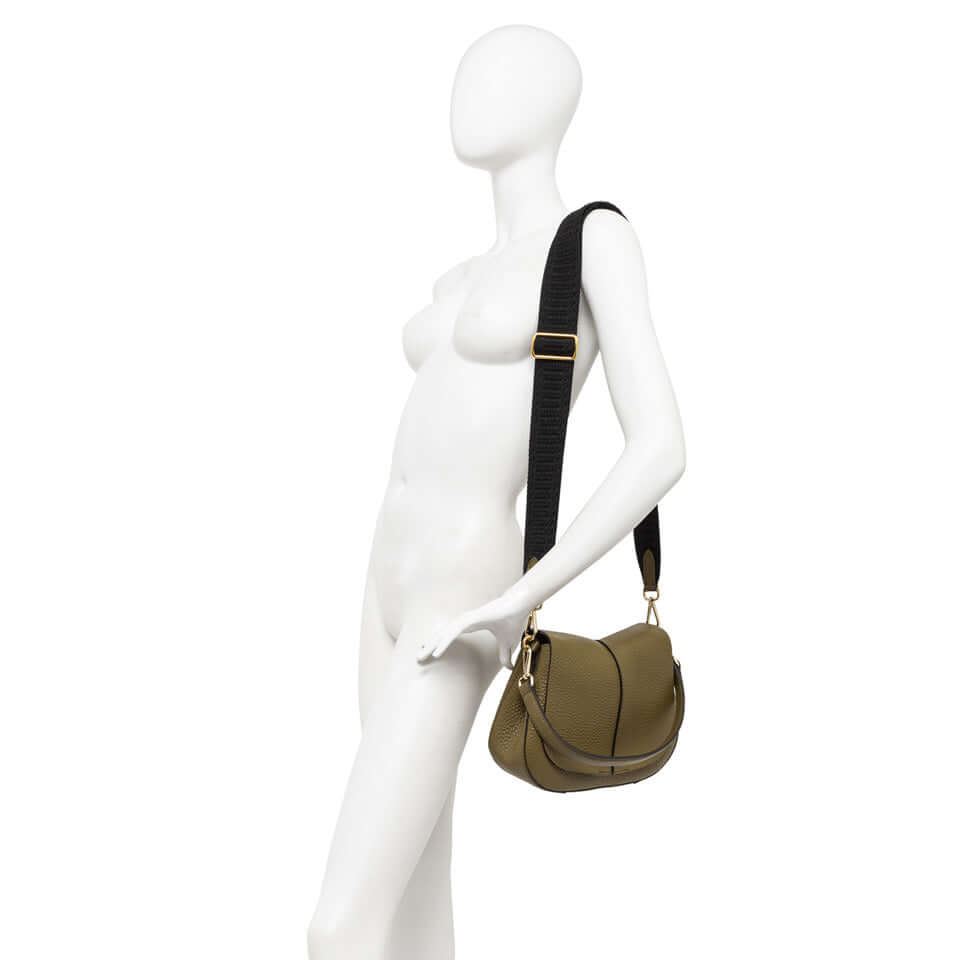 Stylish Helena Round handbag by Gianni Chiarini on a mannequin, showcasing its contemporary design and adjustable straps.