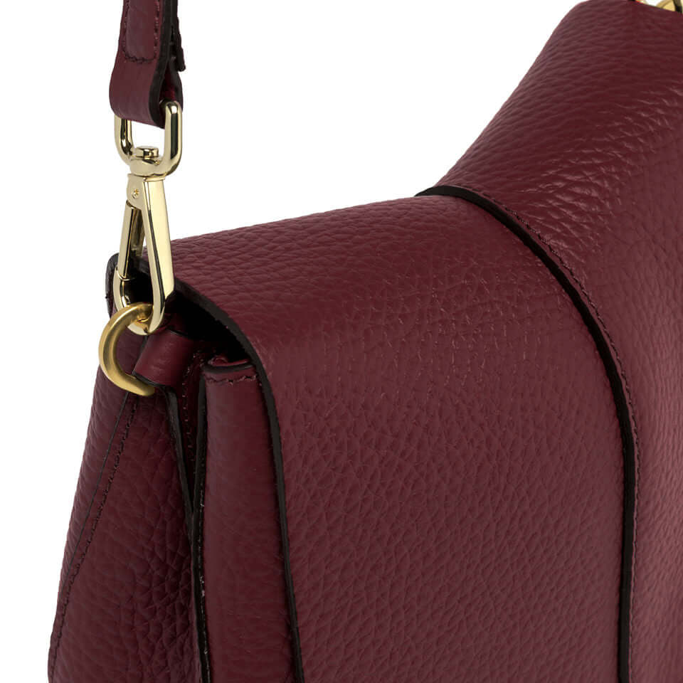 Close-up view of Helena Round handbag by Gianni Chiarini showcasing the textured leather and adjustable strap.