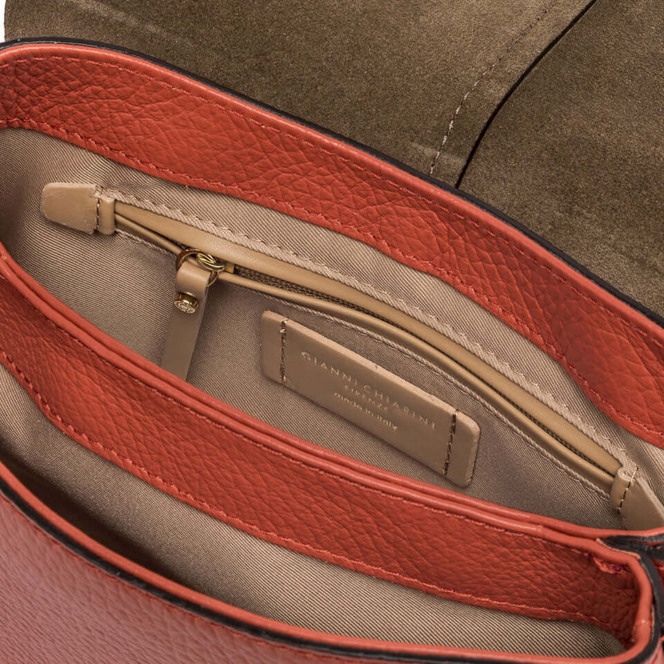 Interior view of Gianni Chiarini Helena Round bag showing textured leather and dual compartments.
