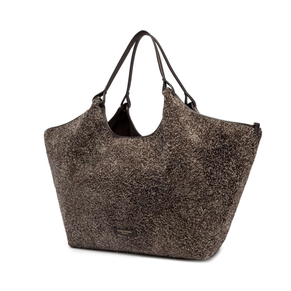 Dua suede bag in dark gray with black straps, spacious design and minimalistic style, ideal for enhancing outfits.