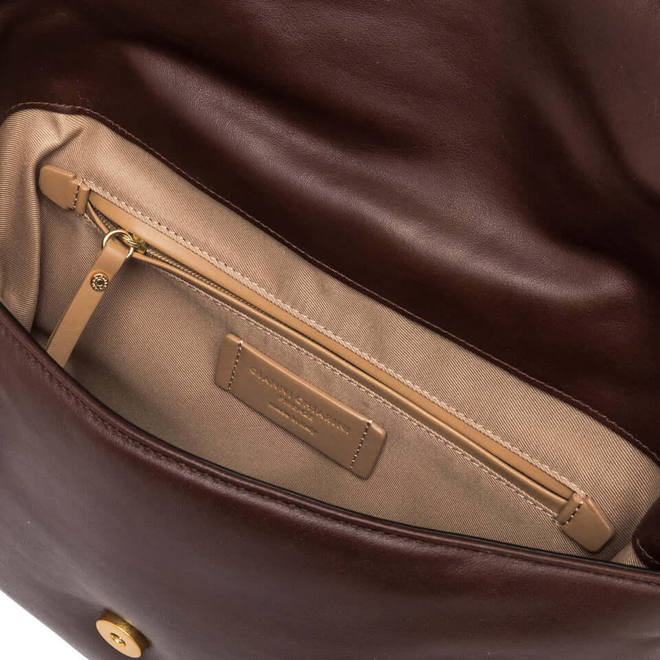 Interior view of Mirea pochette by Gianni Chiarini, featuring a spacious beige lining and a zippered pocket.