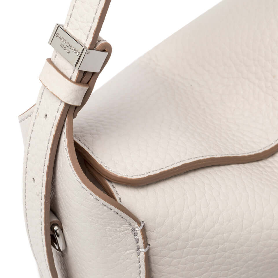 Close-up of Penelope bag showing the double grain leather and adjustable strap details.