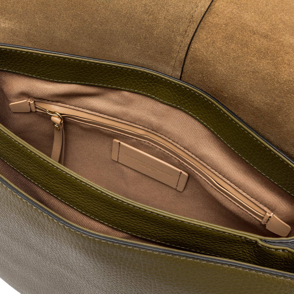 Interior view of the Helena Round bag by Gianni Chiarini, showing double compartments and a zip pocket.