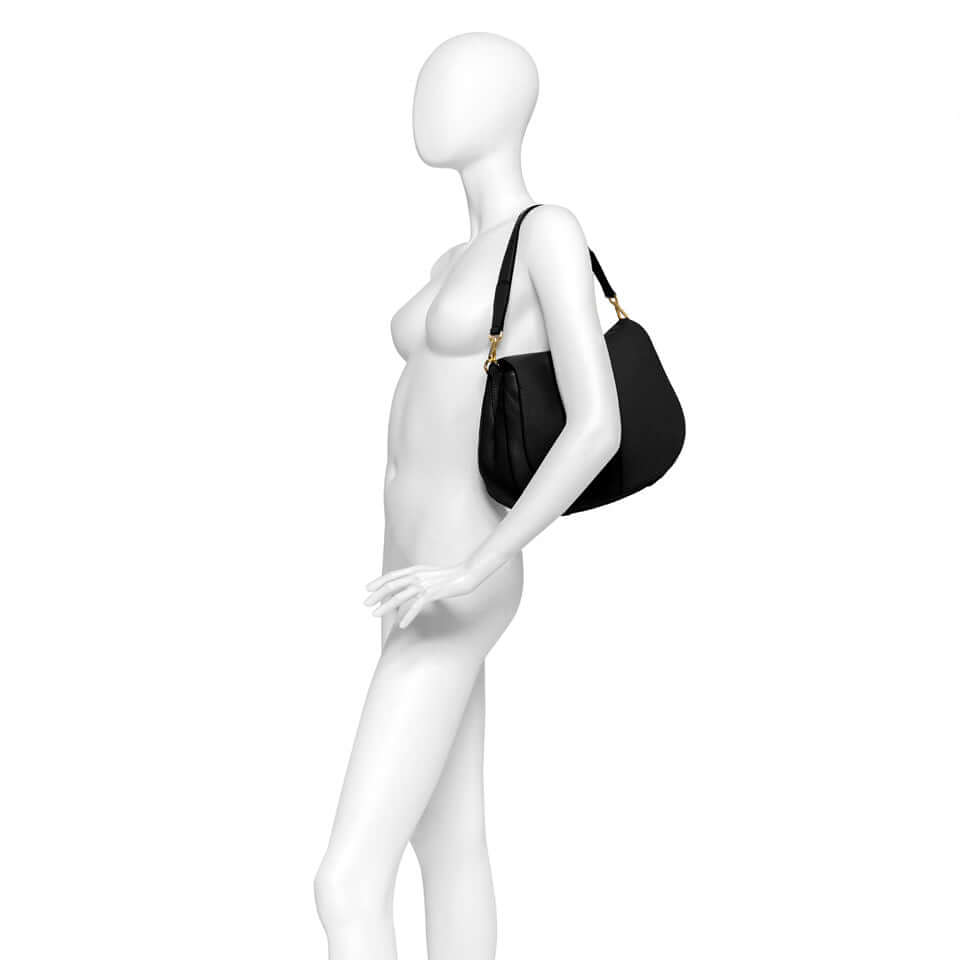 Helena Round handbag by Gianni Chiarini on a mannequin, showcasing its chic design and adjustable shoulder strap.
