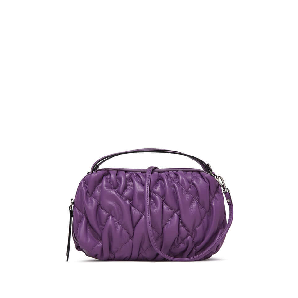 Compact purple handbag with a soft quilted design, featuring dual handles and a detachable shoulder strap.