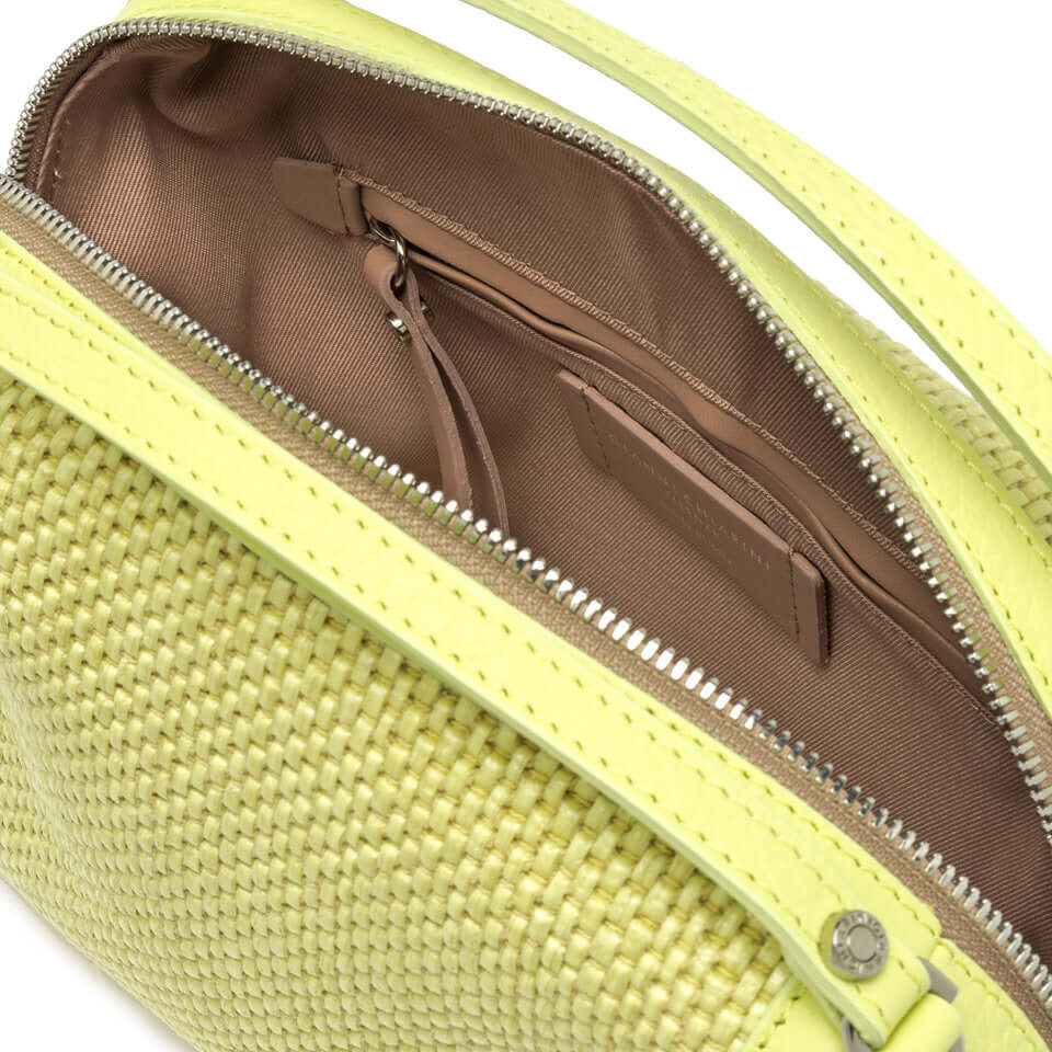 Inside view of the compact Alifa bag by Gianni Chiarini in woven straw, featuring light yellow and leather accents.