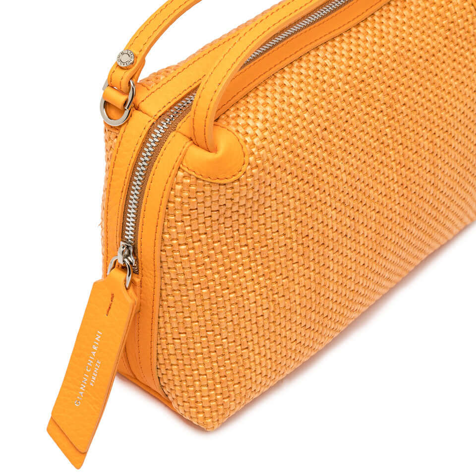 Alifa handbag by Gianni Chiarini in woven straw, compact and lightweight, featuring leather strap and zip closure.