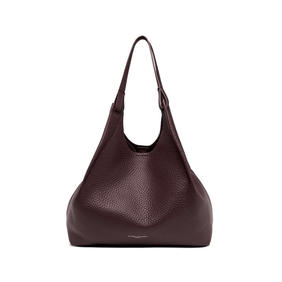 Elegant DUA leather bag in deep burgundy, featuring two handles and a magnetic closure, dimensions 34x38x16 cm.