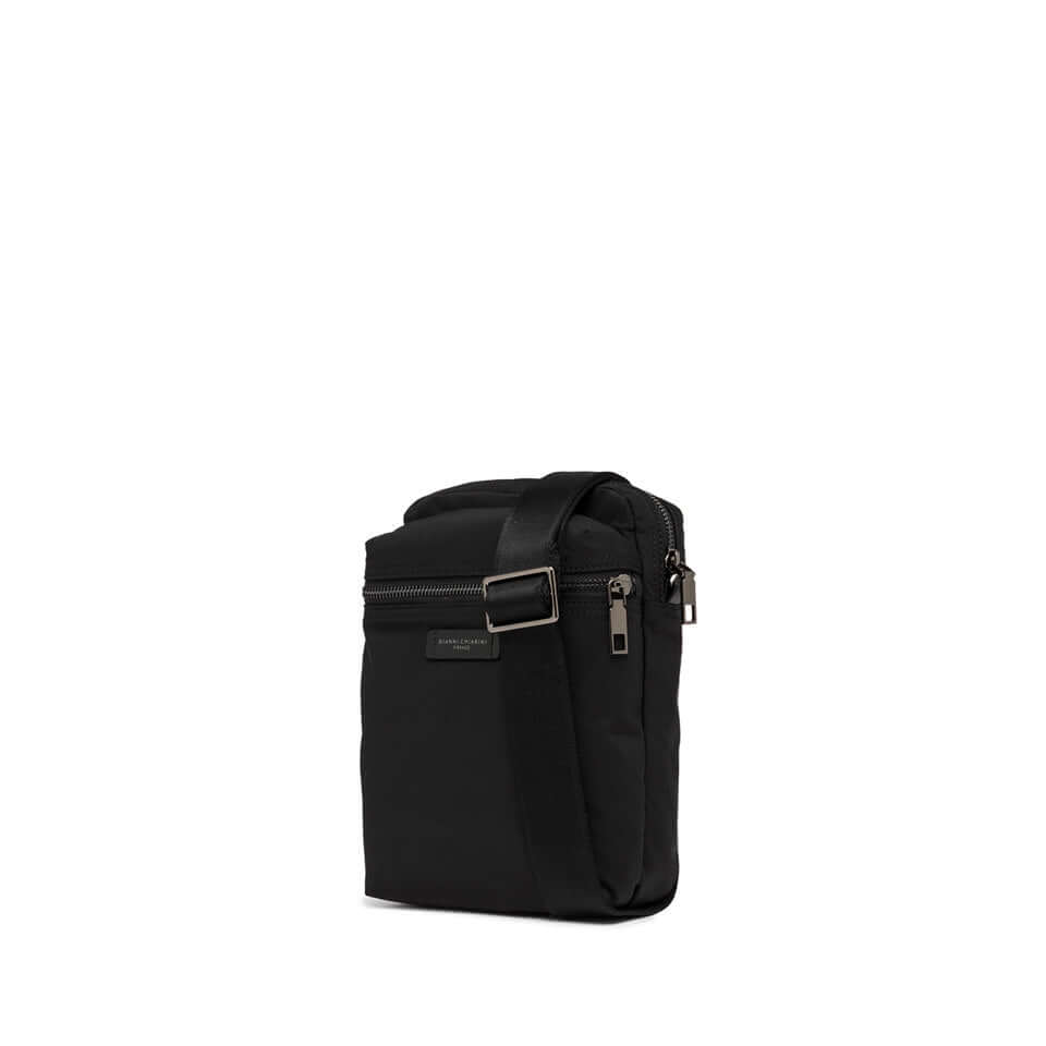 Crossbody bag Oslo in black nylon with leather details, zip closure, and adjustable strap for sporty style.