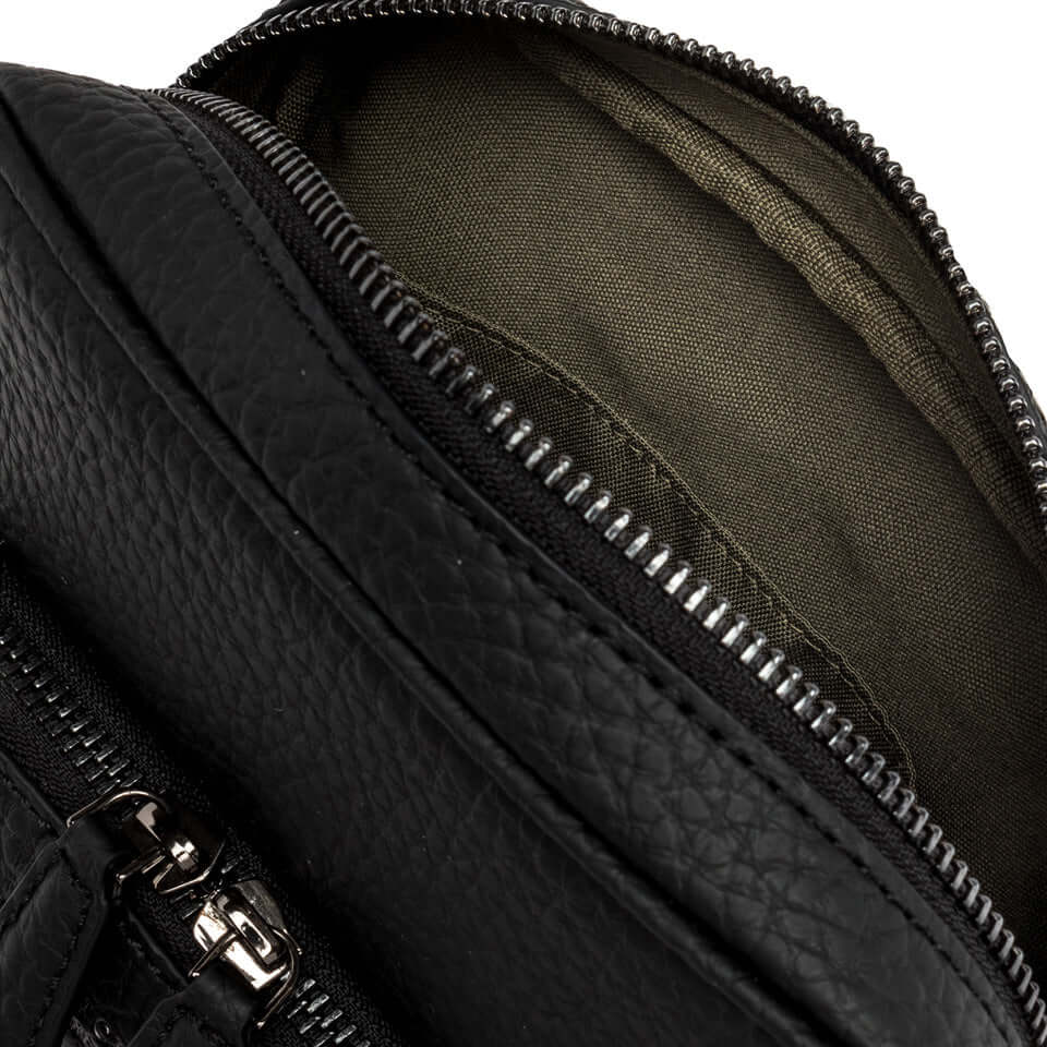 Close-up of Florence bag interior with a zipped compartment and soft lining, showcasing its practical design.
