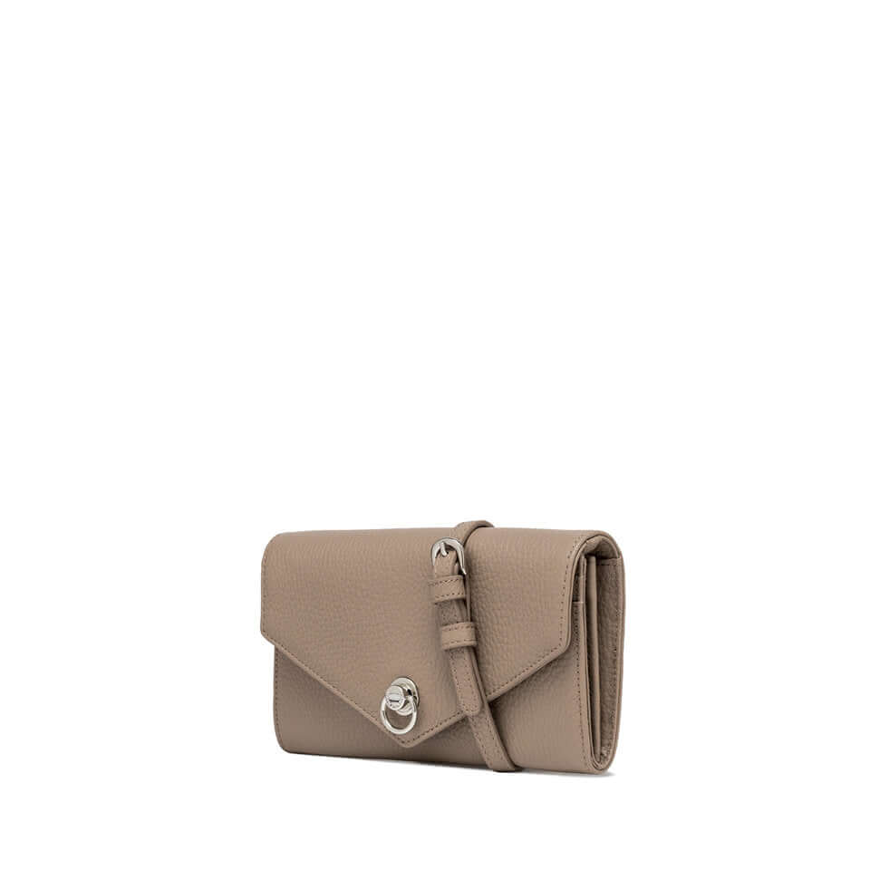 Deva handbag in hammered leather, rectangular shape with a top flap and iconic ring detail, featuring a removable shoulder strap.