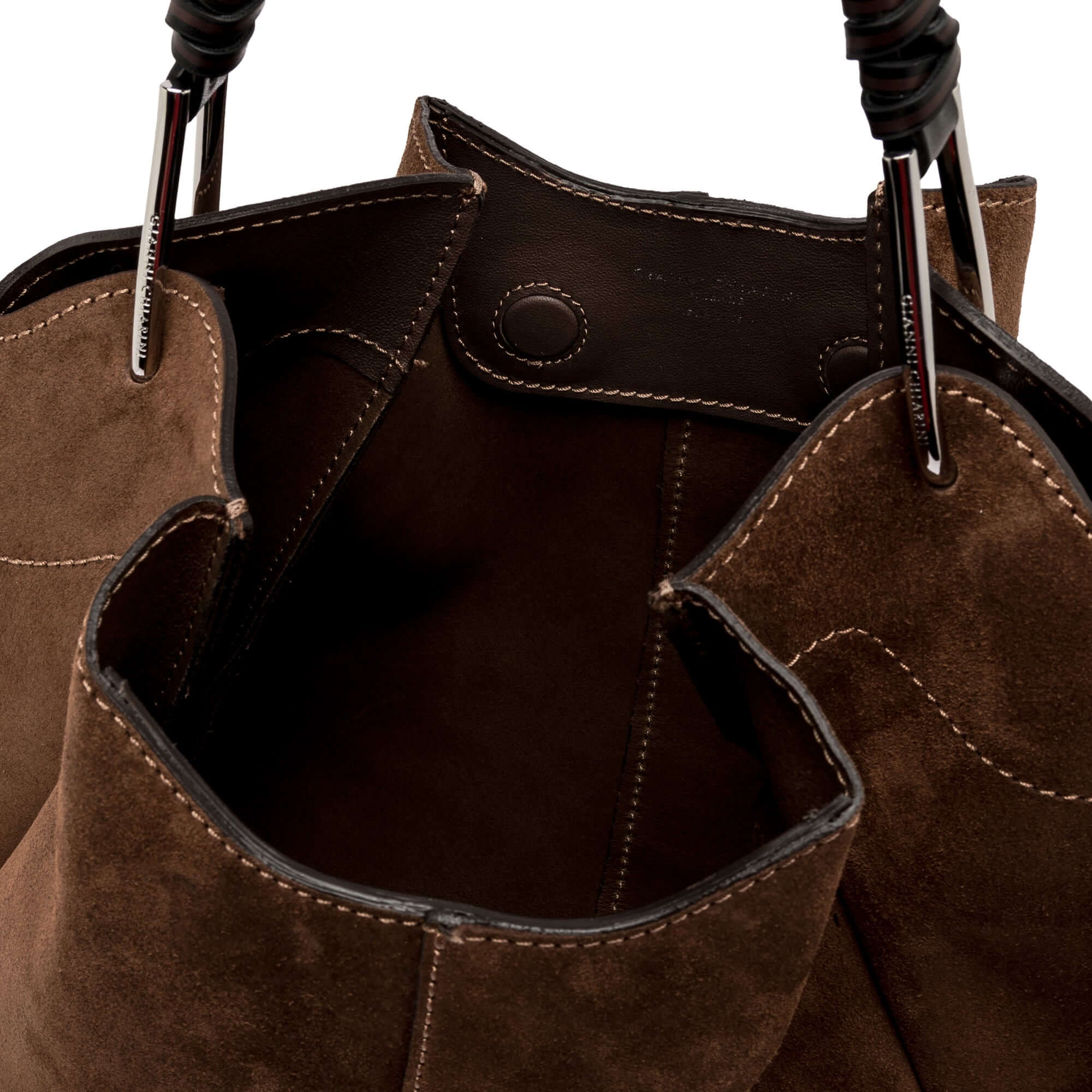 Interior view of Gianni Chiarini Era handbag in brown suede, showcasing spacious design and quality craftsmanship.