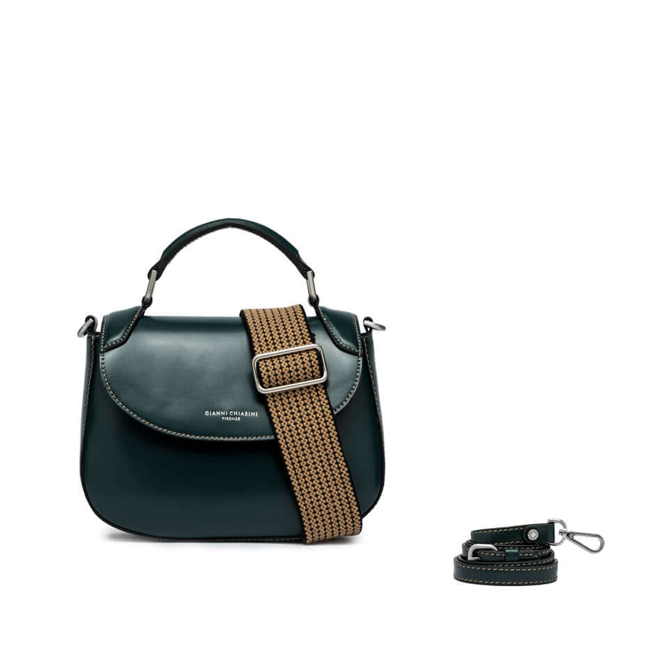 Elegant green leather handbag with a woven strap, showcasing versatility as a hand and crossbody bag.