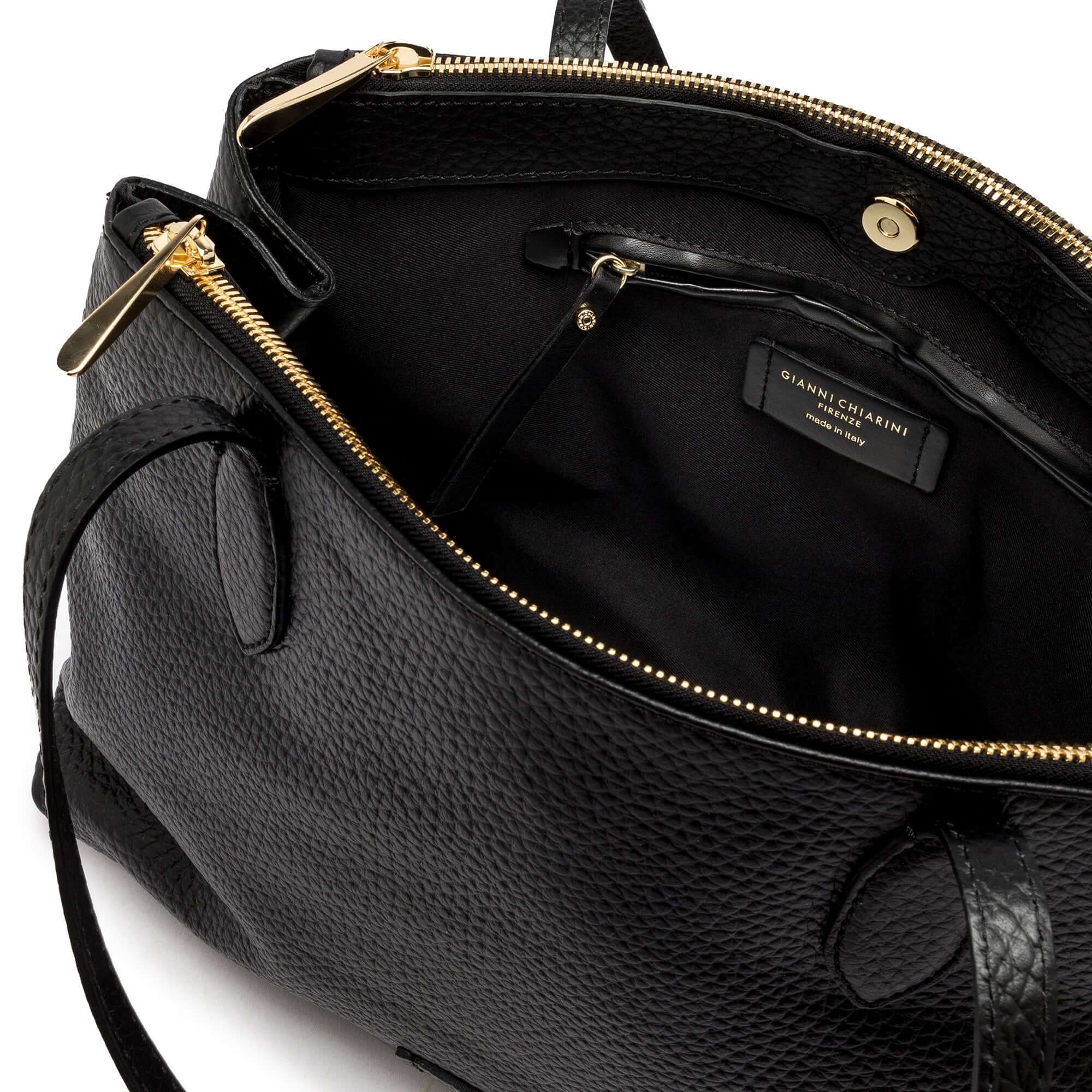 Interior view of Mara shopping bag showcasing elegant black leather and practical compartments.