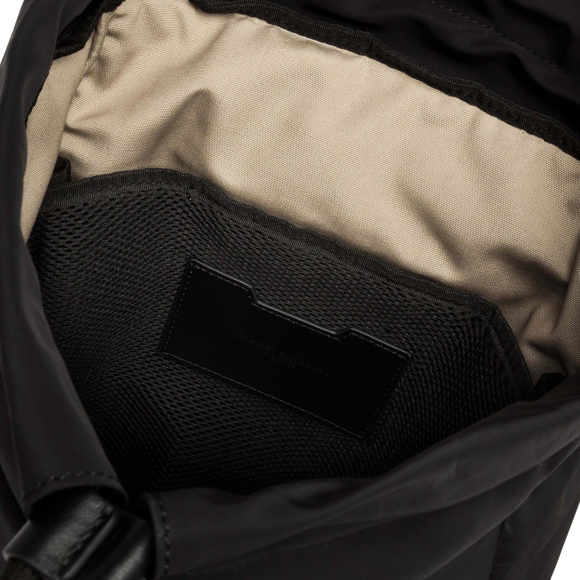 Interior view of the Gianni Chiarini Oslo backpack featuring a spacious main compartment and mesh pocket.
