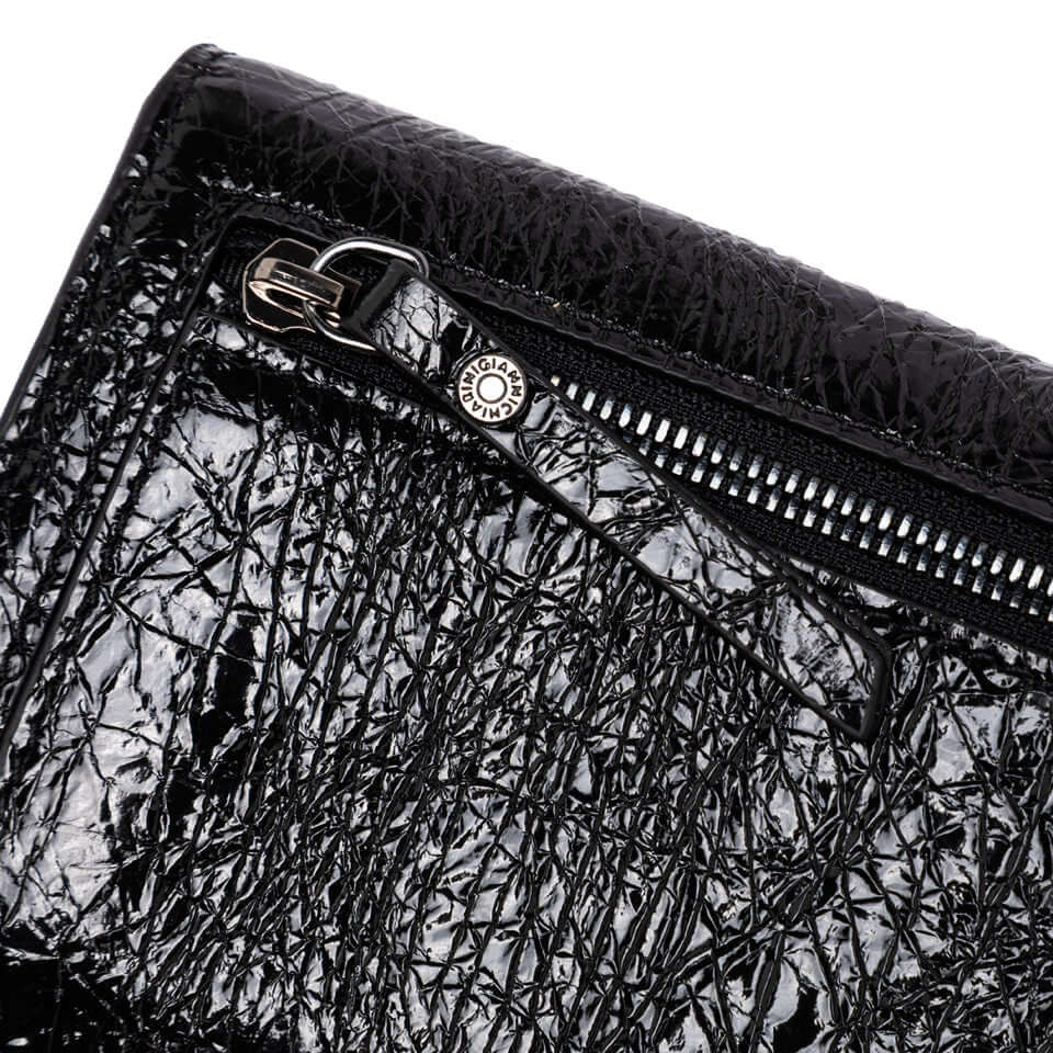 Close-up of black shiny leather Wallets Dollaro Gianni Chiarini wallet with zipped pocket detail.