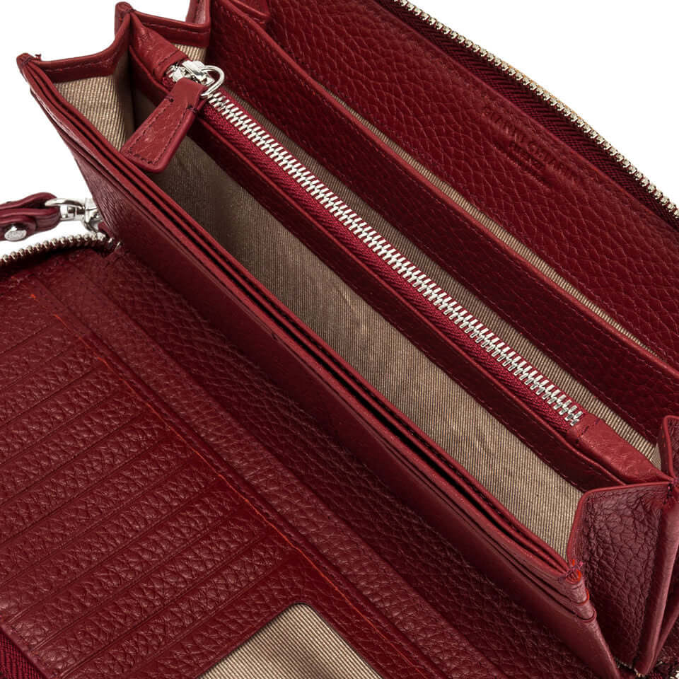 Interior view of the Wallets Dollaro by Gianni Chiarini, showcasing zip compartments and card slots in textured red leather.