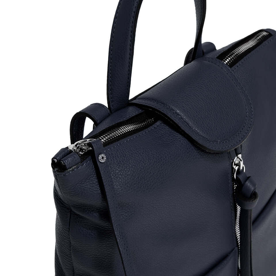 Close-up of the Giada bag featuring a textured leather exterior, zipper closure, and adjustable leather handles.