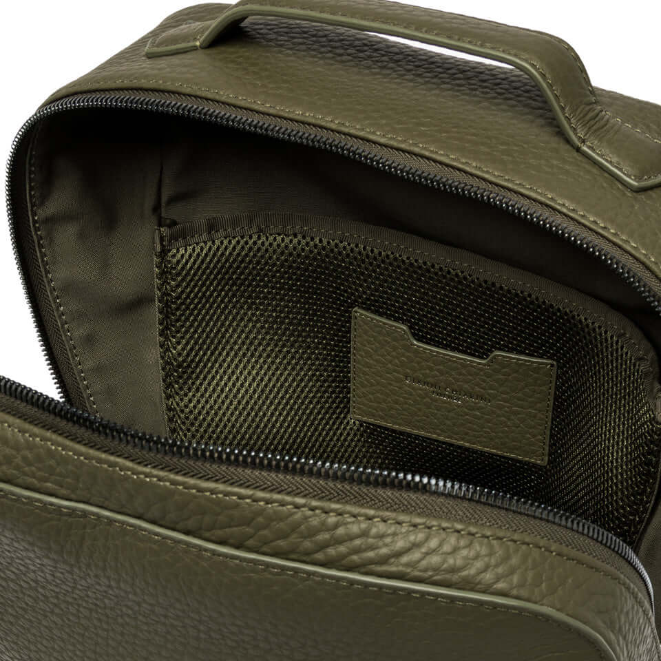 Interior view of Gianni Chiarini Firenze Florence backpack featuring a zip compartment and fabric lining.