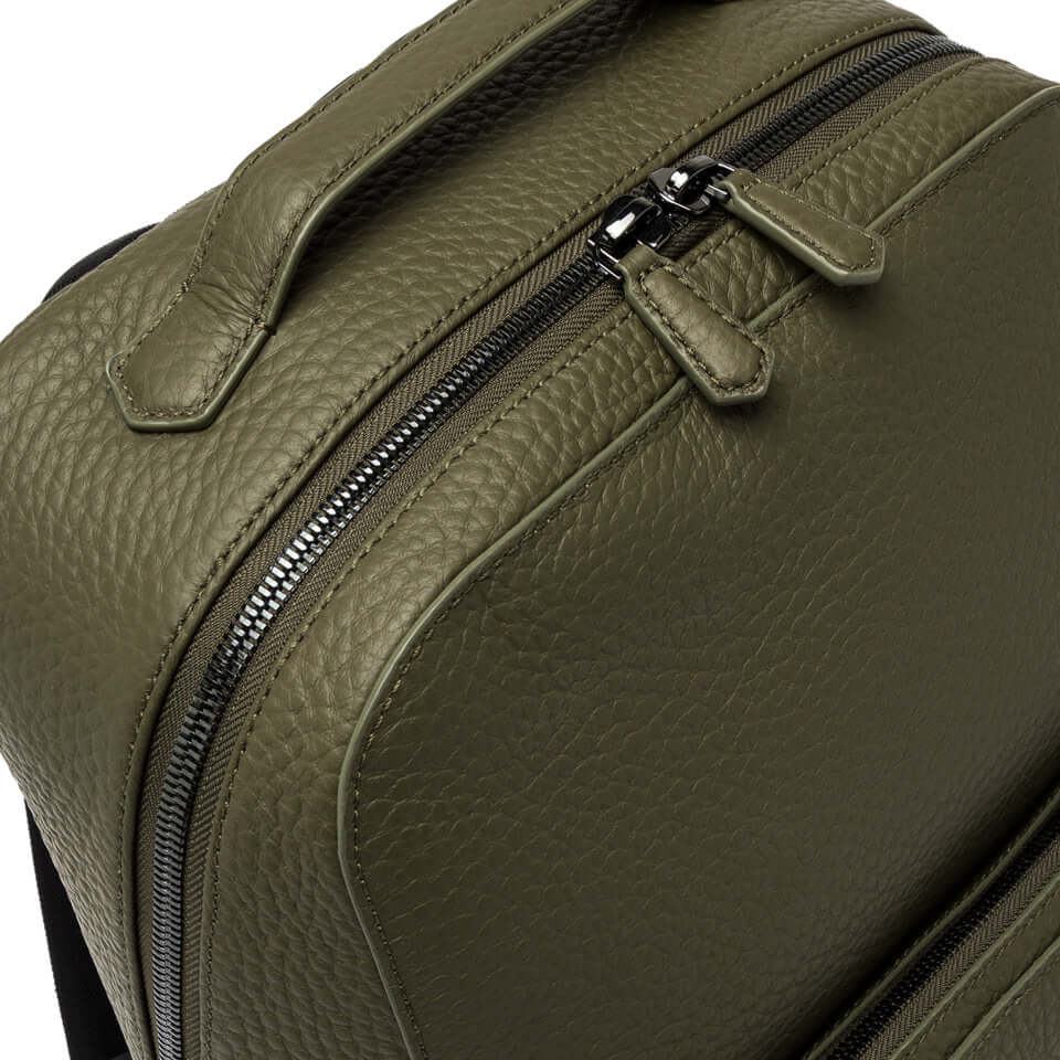 Close-up of the Florence backpack in olive green leather by Gianni Chiarini, featuring zippers and clean design.