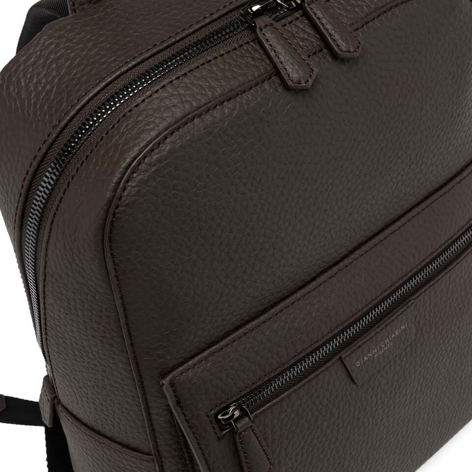 FLORENCE by Gianni Chiarini, a sleek brown leather backpack with minimal design and functional front pocket.