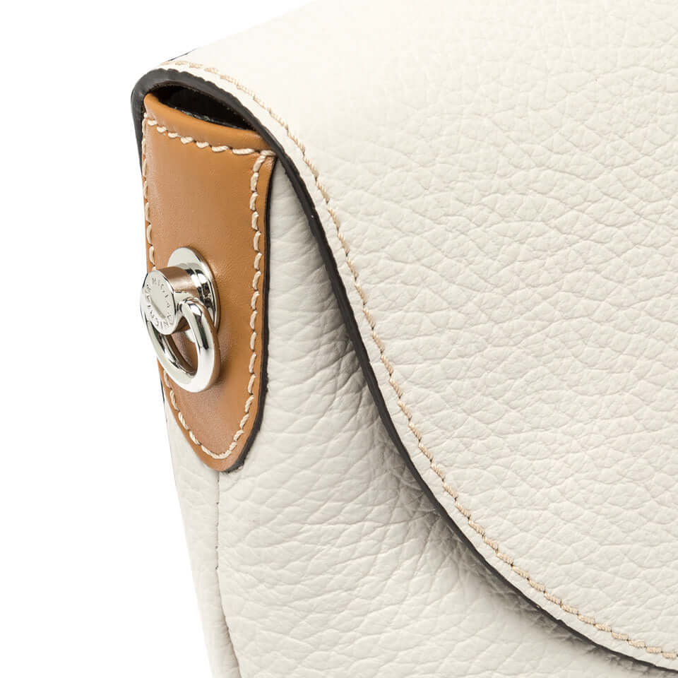 Close-up of Alessandra bag by Gianni Chiarini, showcasing the textured leather and button closure detail.