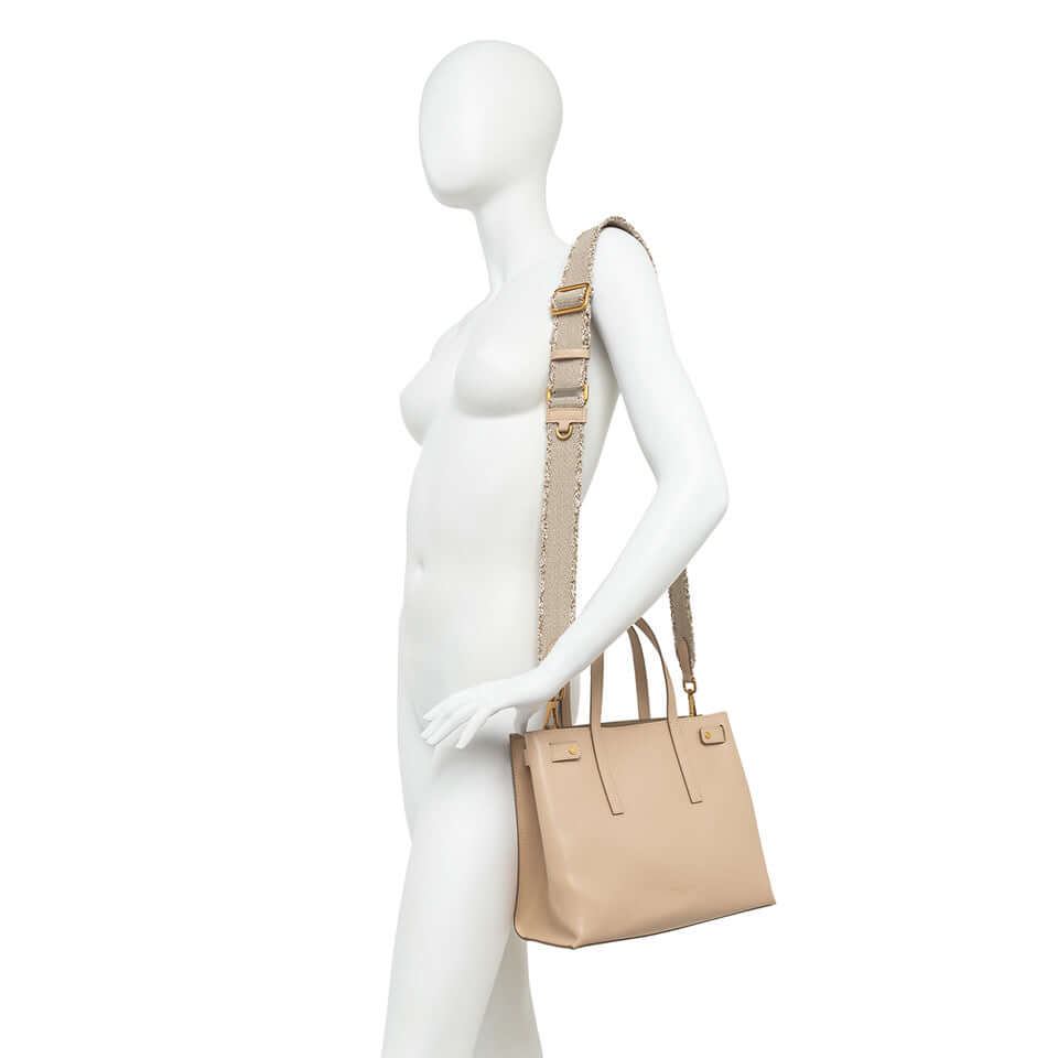 Altea bag displayed on a mannequin with removable strap, showcasing its timeless design and practical size.
