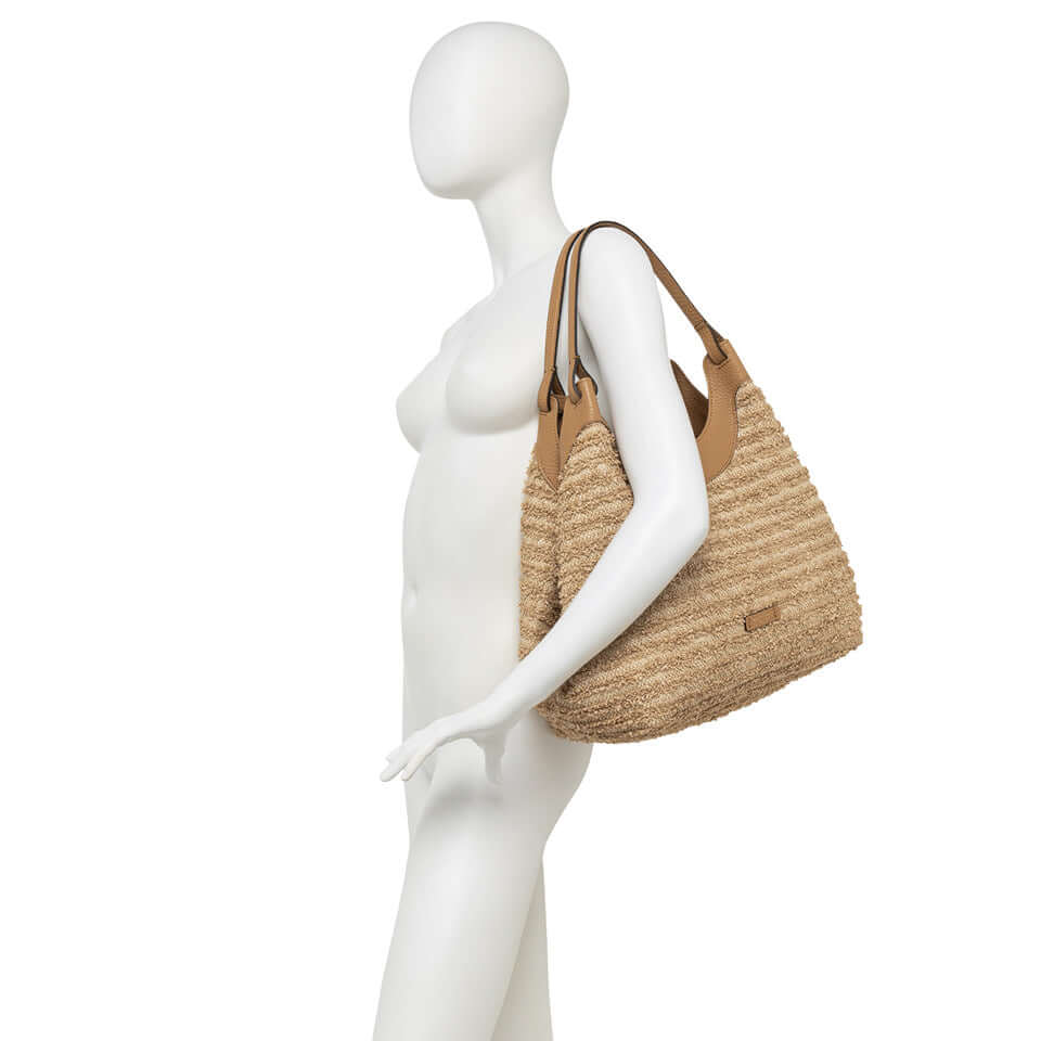 DUA straw bag with leather accents, featuring double handles and a chic design, perfect for any outfit.