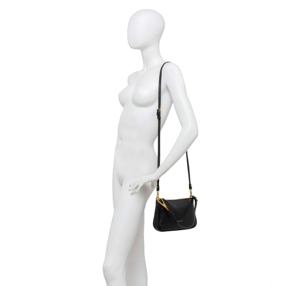 Elegant black leather Brooke handbag by Gianni Chiarini Firenze displayed on a mannequin, featuring a removable shoulder strap.