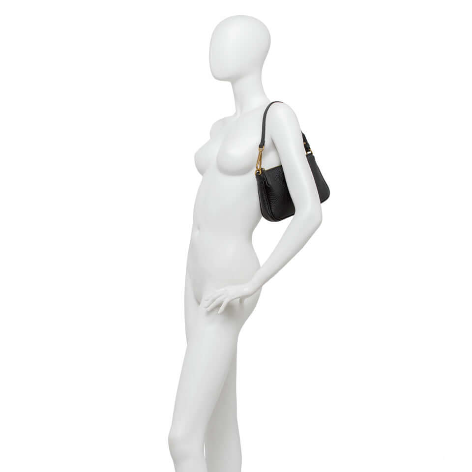 Elegant Brooke bag by Gianni Chiarini Firenze displayed on a mannequin, showcasing its sleek design and removable handle.