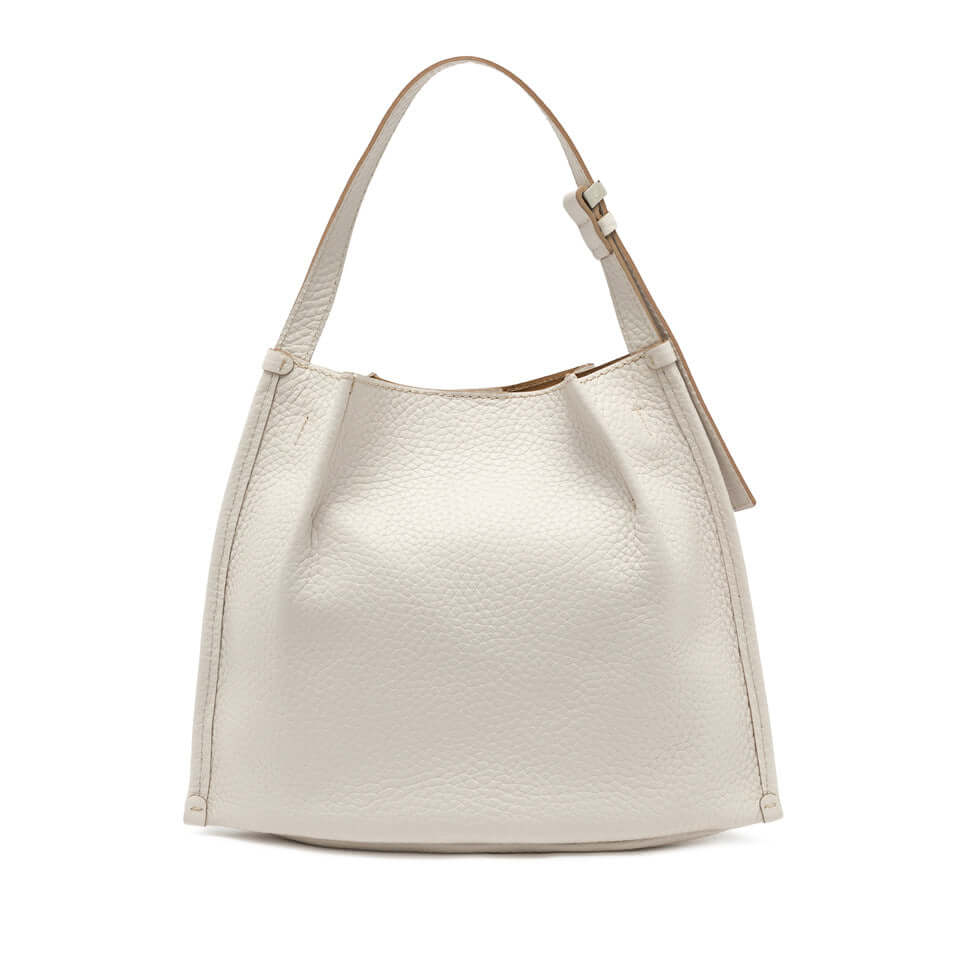 Dory lightweight bag in cream leather with simple design and adjustable handle, ideal for casual styles.