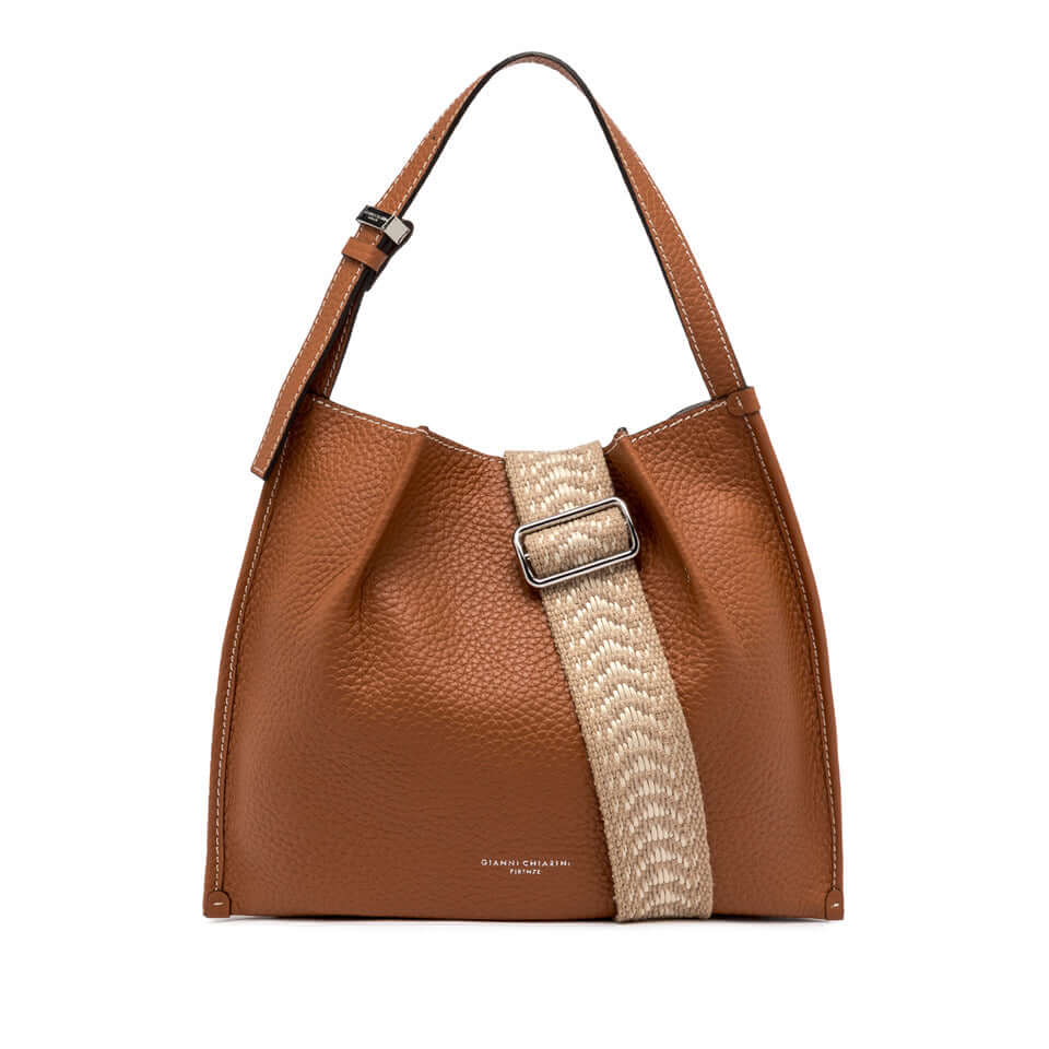 Brown leather handbag with strap and woven detail, perfect for casual stylish looks.