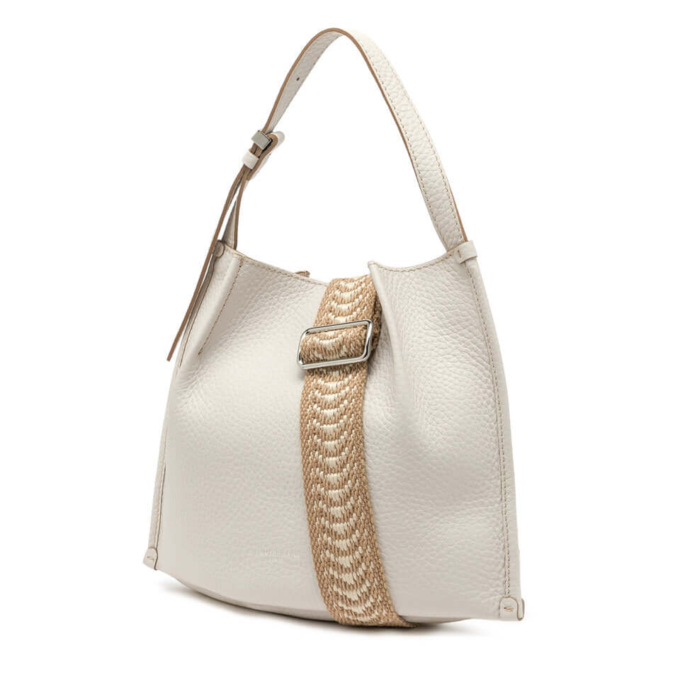Dory handbag featuring a lightweight design, a textured finish, and a stylish woven strap for casual looks.