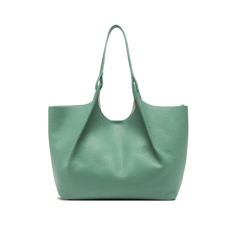 Contemporary green leather tote bag with two handles and magnetic closure, perfect for enhancing any outfit.
